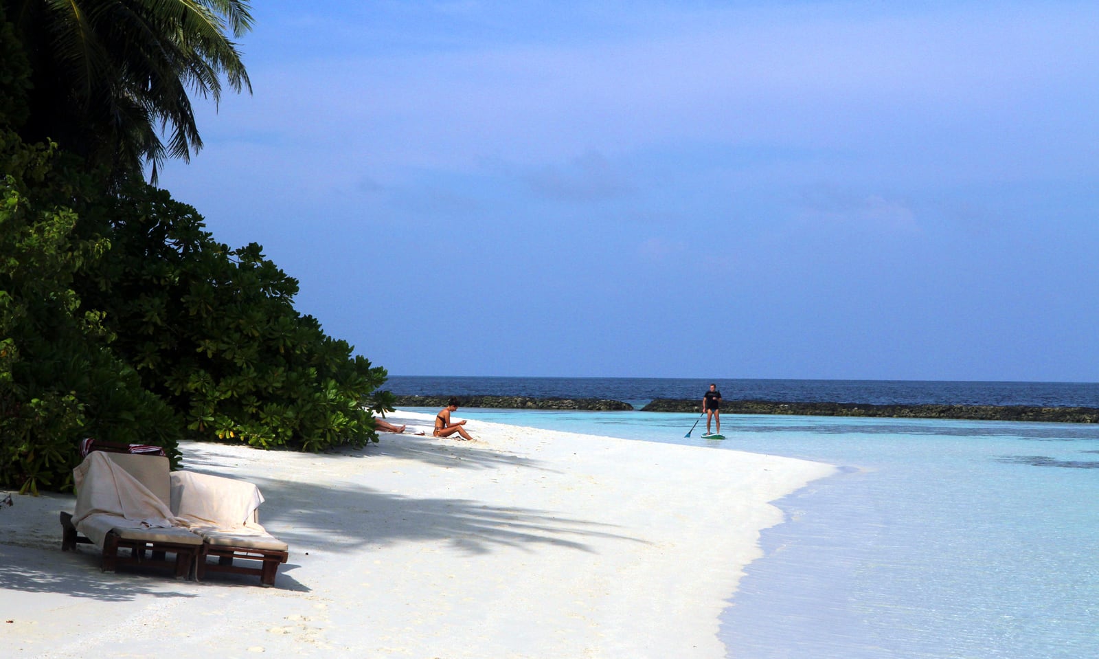 Land, speedboat, first reef
