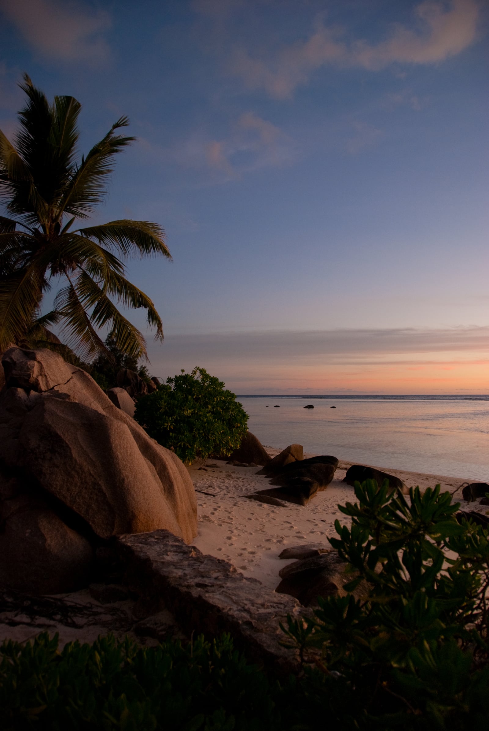 A private sunset table on the boulders of Anse Source d'Argent